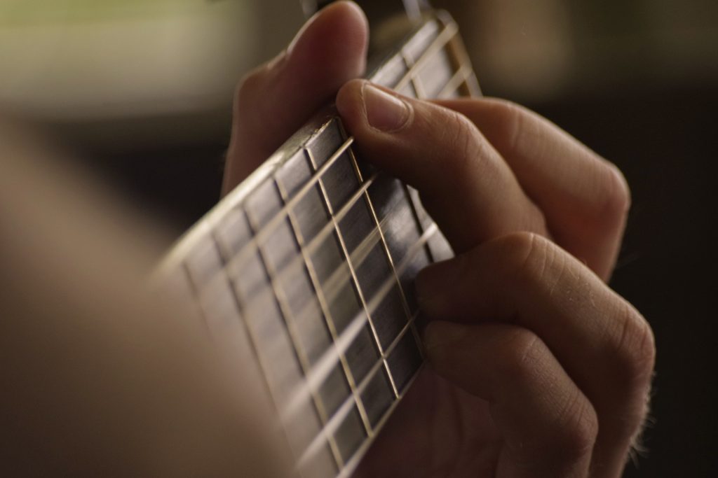 Fingers Forming Guitar Chord