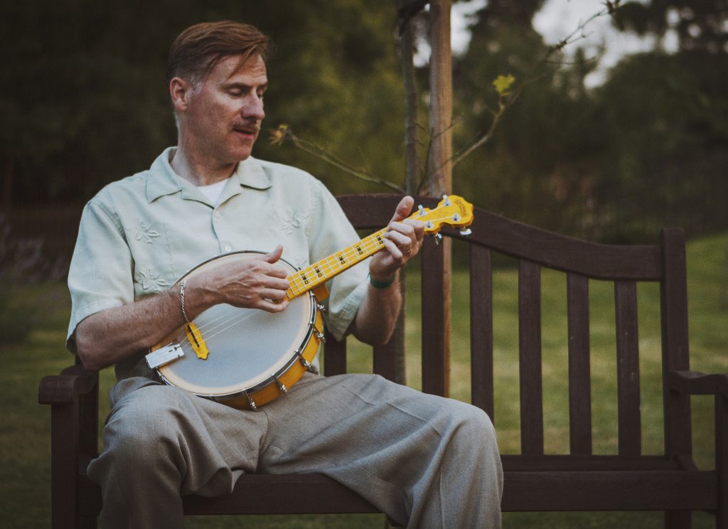 Man Playing a Banjolele